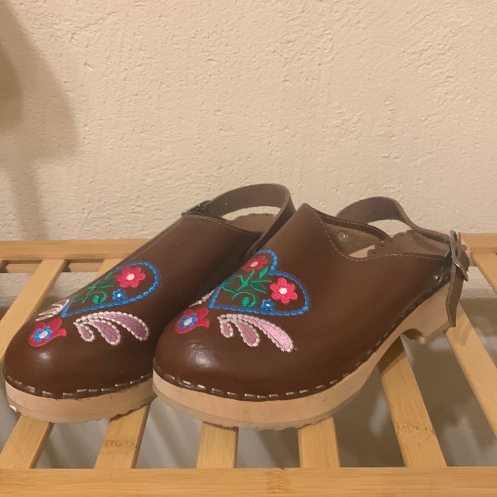 Embroidered wooden clogs